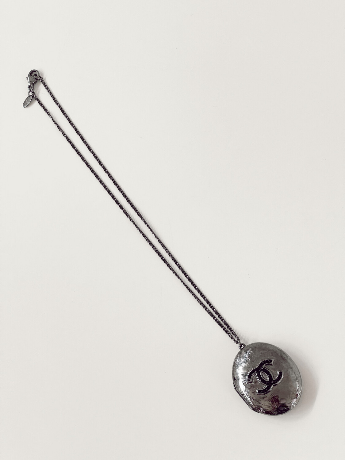 CHANEL CC LARGE SILVER LOCKET PENDANT NECKLACE