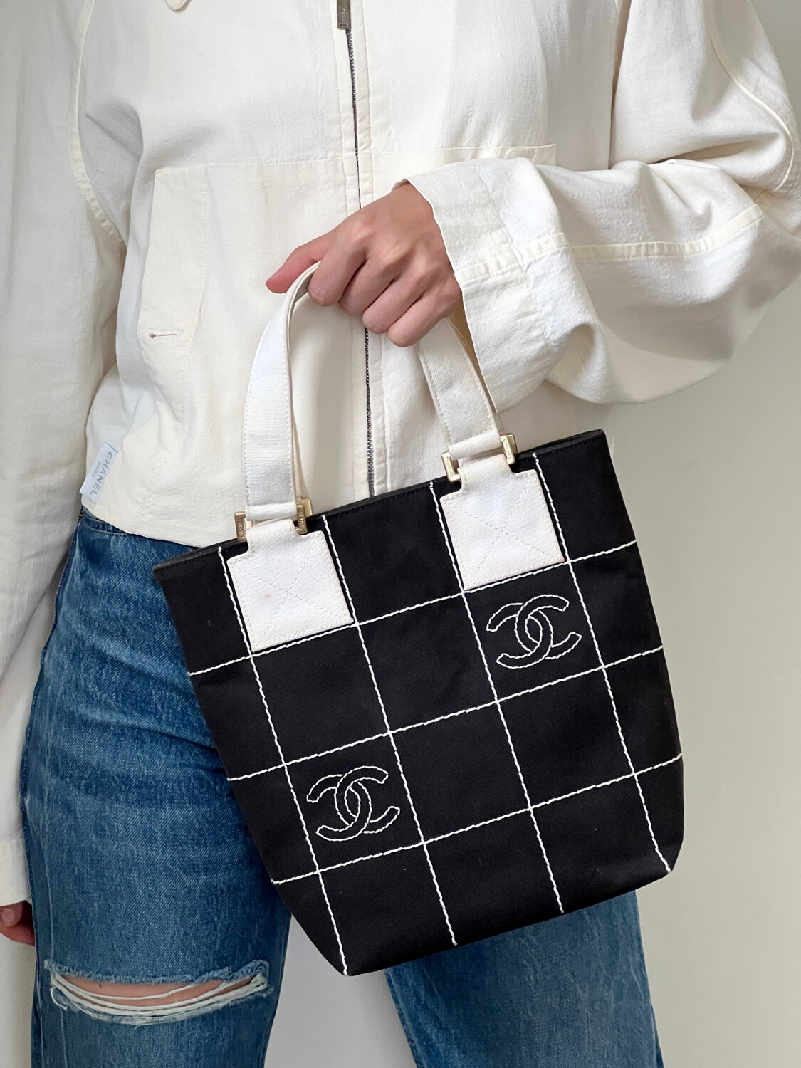 black chanel handbag with white logo