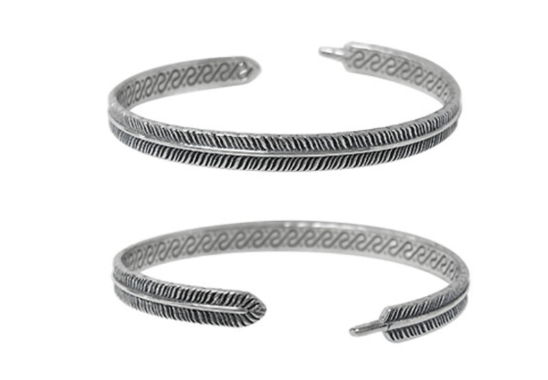 Sterling silver, detail feather bangle. Approx size: 5mm width