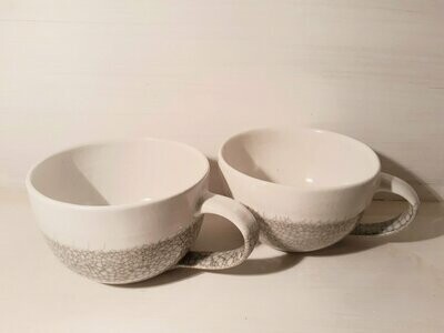 A Set of Two Stoneware Cups