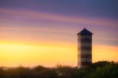 Vuurtoren Dishoek onder kleurrijke lucht