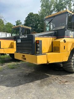2 Cat 250E Articulated Trucks