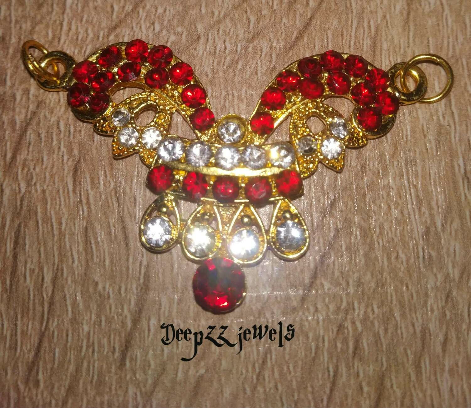 Pendent with red stones