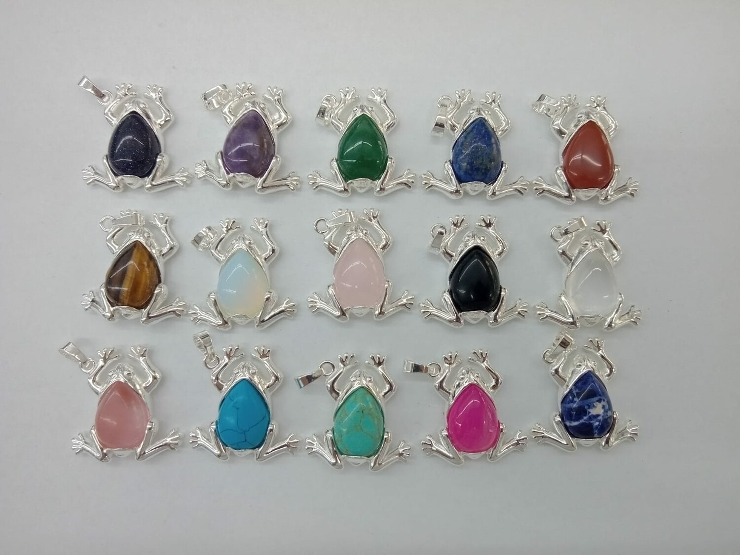 Dijes de ranitas con baño de plata