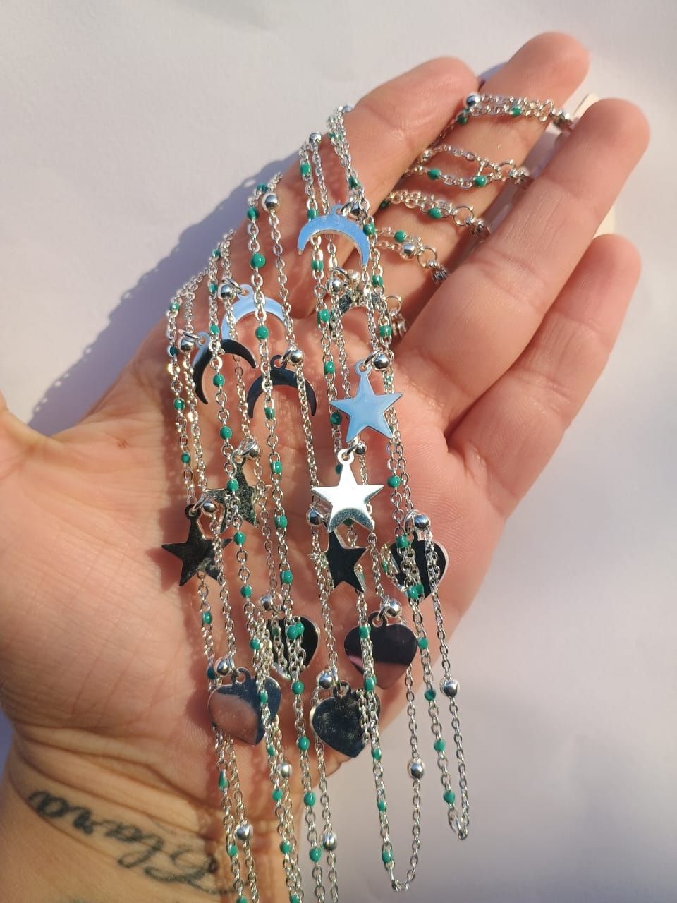 pulseras acero blanco luna, estrellas y corazon
