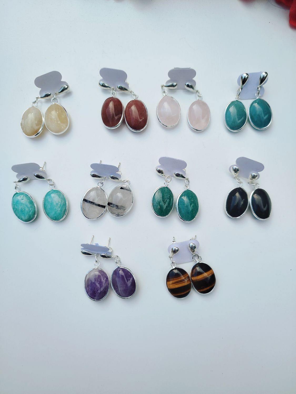 Aritos ovales colgantes con baño de plata