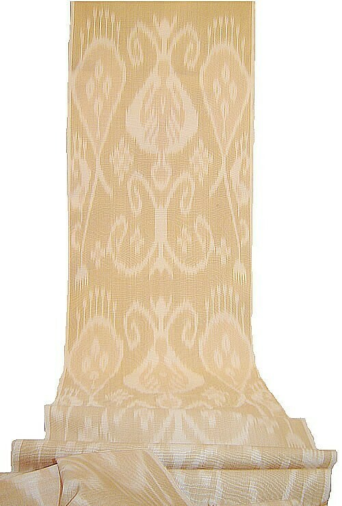 Beige and cream ikat fabric with a moire pattern