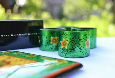 A set of hand painted napkin rings