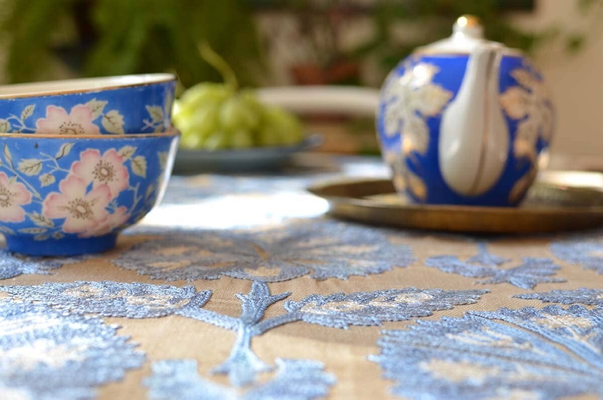 Blue suzani embroidery on beige silk base