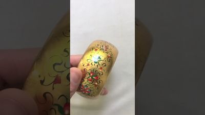 Hand painted bracelet on a golden foil