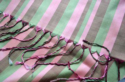 Striped silk scarf in soft peach, pistachio green, and chocolate brown