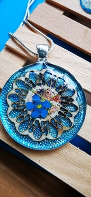 Wood wheel and blue flower pendant