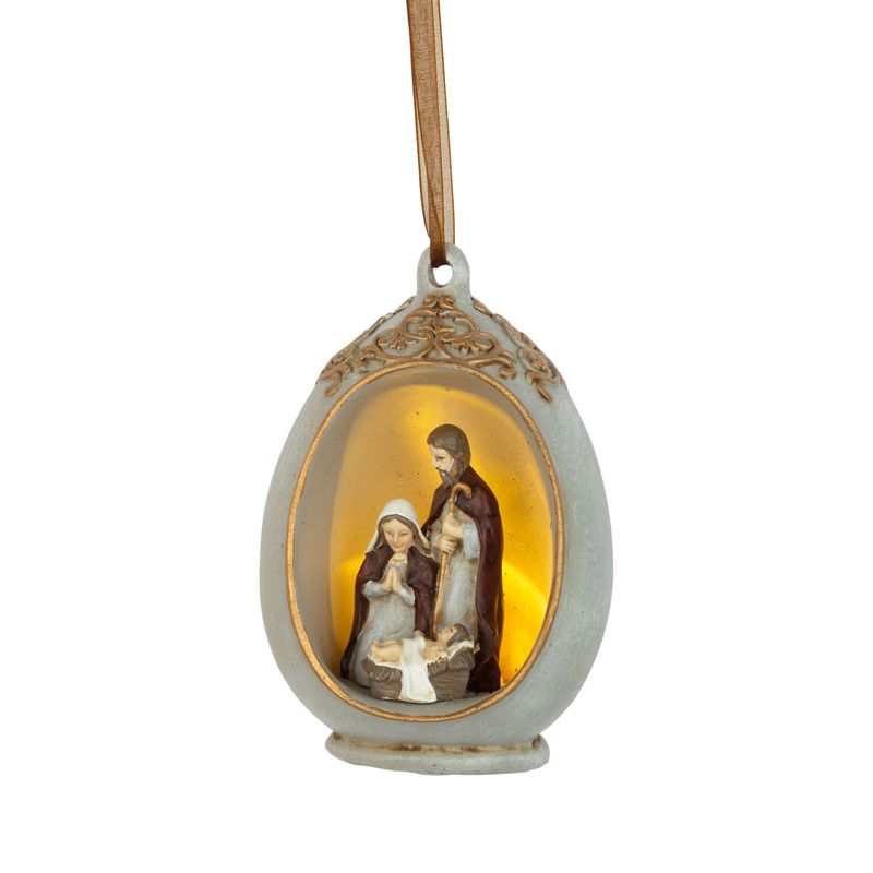Painted resin nativity scene in egg shaped frame, LED  4 in  8