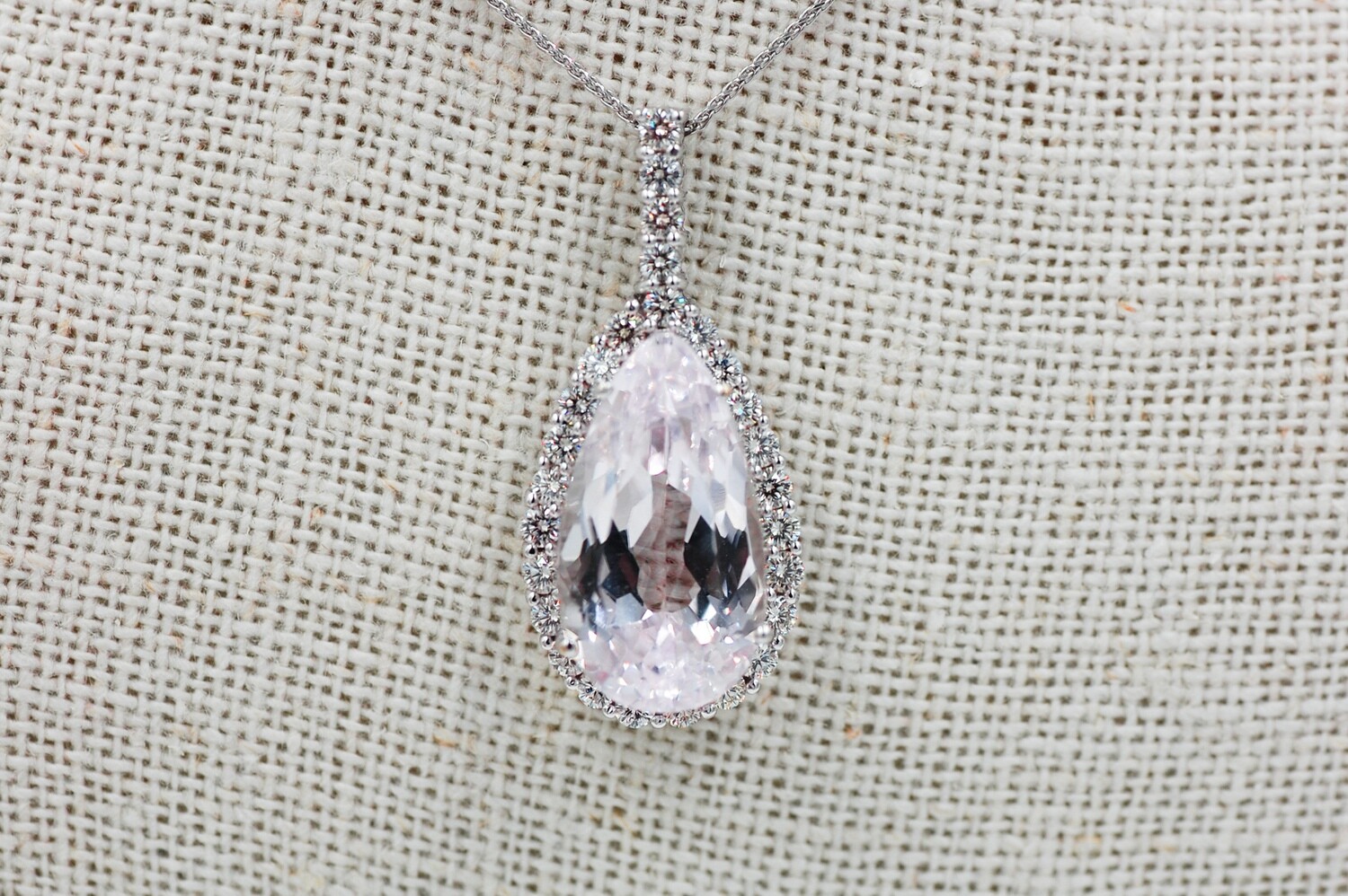 18k wg Pear shape 11.98ct Kunzite pendant w/ .89cttw diamond accents - 18" chain