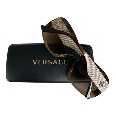 A beautiful pair of Versace sunglasses in a gorgeous tortoiseshell colour with gold accents and featuring the Medusa logo to the arms