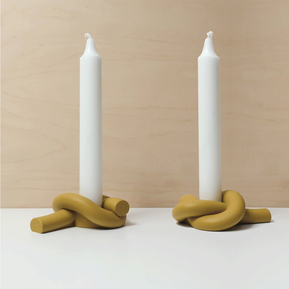 knot candleholder. Design candleholder - knot/button shaped candlestick