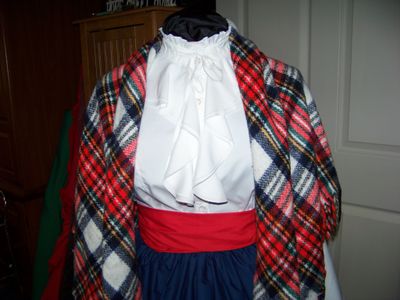 Dickens Costume Navy Blue Skirt with Red Sash and Navy Blue, Red, green, black, orange and white rectangle Shawl one size fits most.