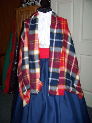Dickens Costume Navy Blue Skirt with Red Sash and Navy Blue, Red, yellow and white rectangle Shawl one size fits most.