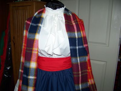 Dickens Costume Navy Blue Skirt with Red Sash and Navy Blue, Red, yellow and white rectangle Shawl one size fits most.