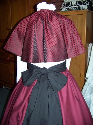 Ladies Dickens Outfit, Civil War costume Cranberry Long cotton blend drawstring SKIRT and Cranberry and black plaid cape with black sash one size fits most Handmade in the USA