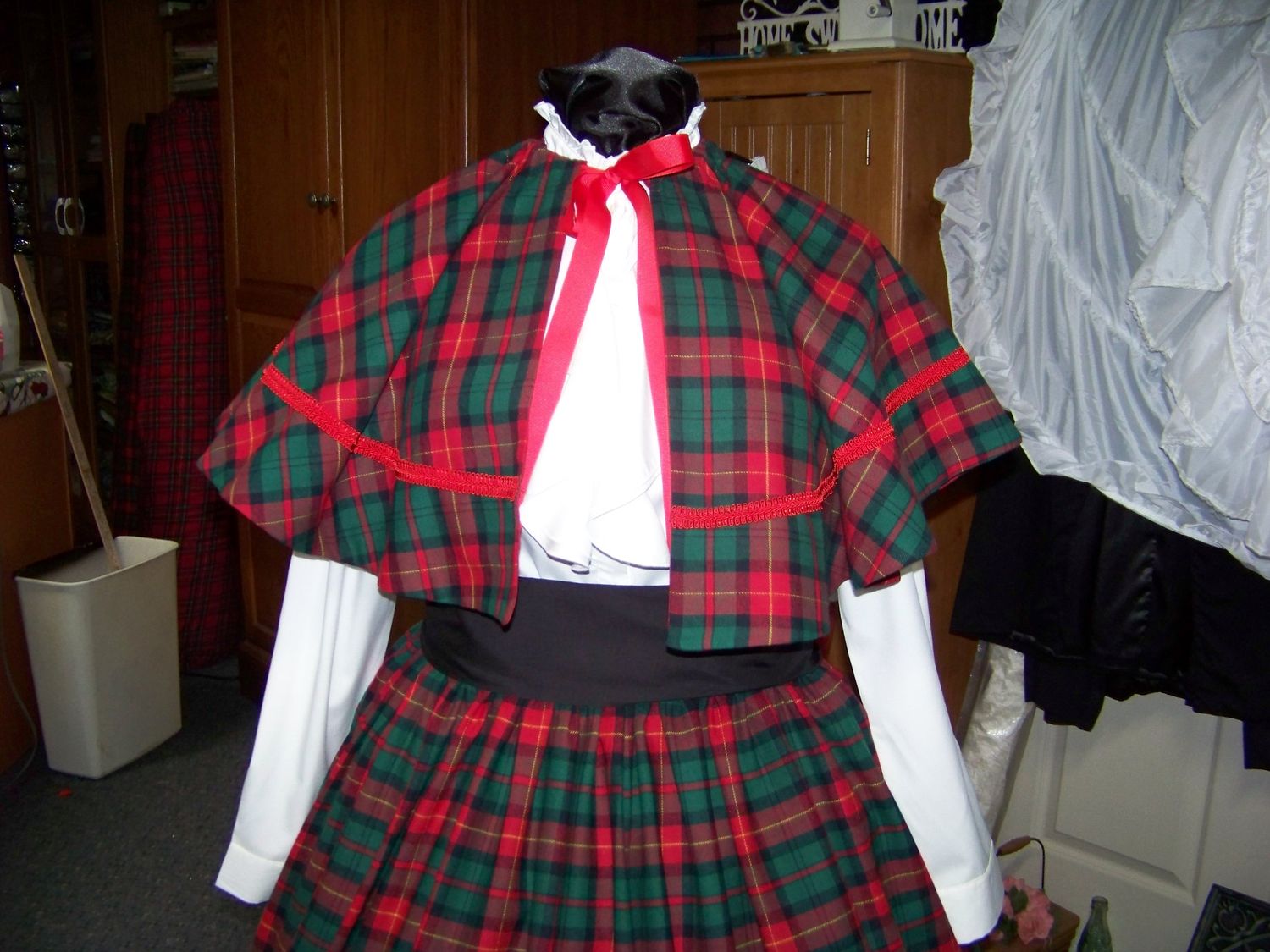 Custom Order Shanna in Ohio Christmas Caroler cape Red and black and green Plaid cape reversible red solid on back one size fits most with matching plaid skirt and black sash
