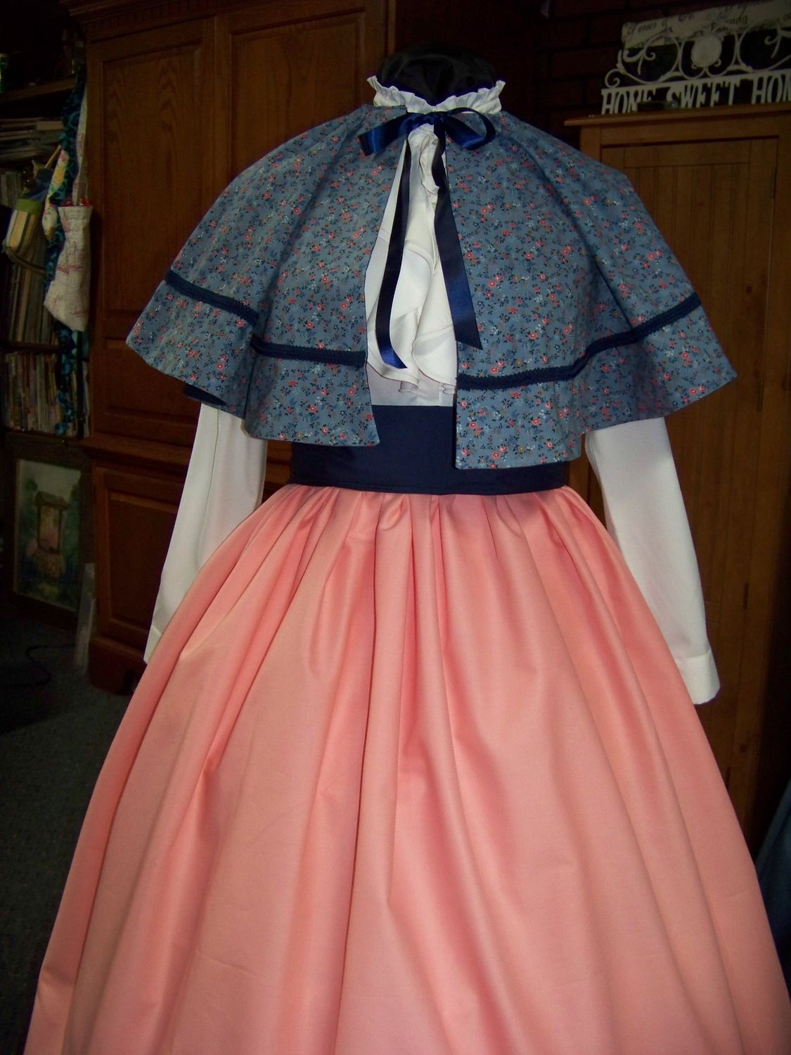 Dickens Civil War Ladies Peach solid cotton blend Long Skirt and Navy-blue Sash with Blue and peach Calico Cape one size fits most. Handmade USA