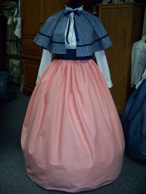 Dickens Civil War Ladies Peach solid cotton blend Long Skirt and Navy-blue Sash with Blue and peach Calico Cape one size fits most. Handmade USA