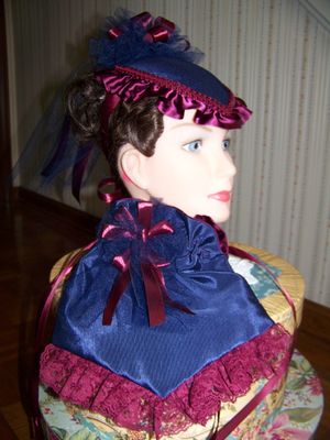 Dicken's Christmas Plus size 3-piece outfit and matching hat and purse. Navy-Blue, Cranberry and yellow check skirt with solid Navy-blue cape and Hat and Purse