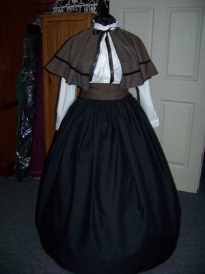 Ladies Dickens Fair costume Long drawstring Black cotton blend skirt, Cape is black and Tan small plaid with black braid one size fits most with Tan sash