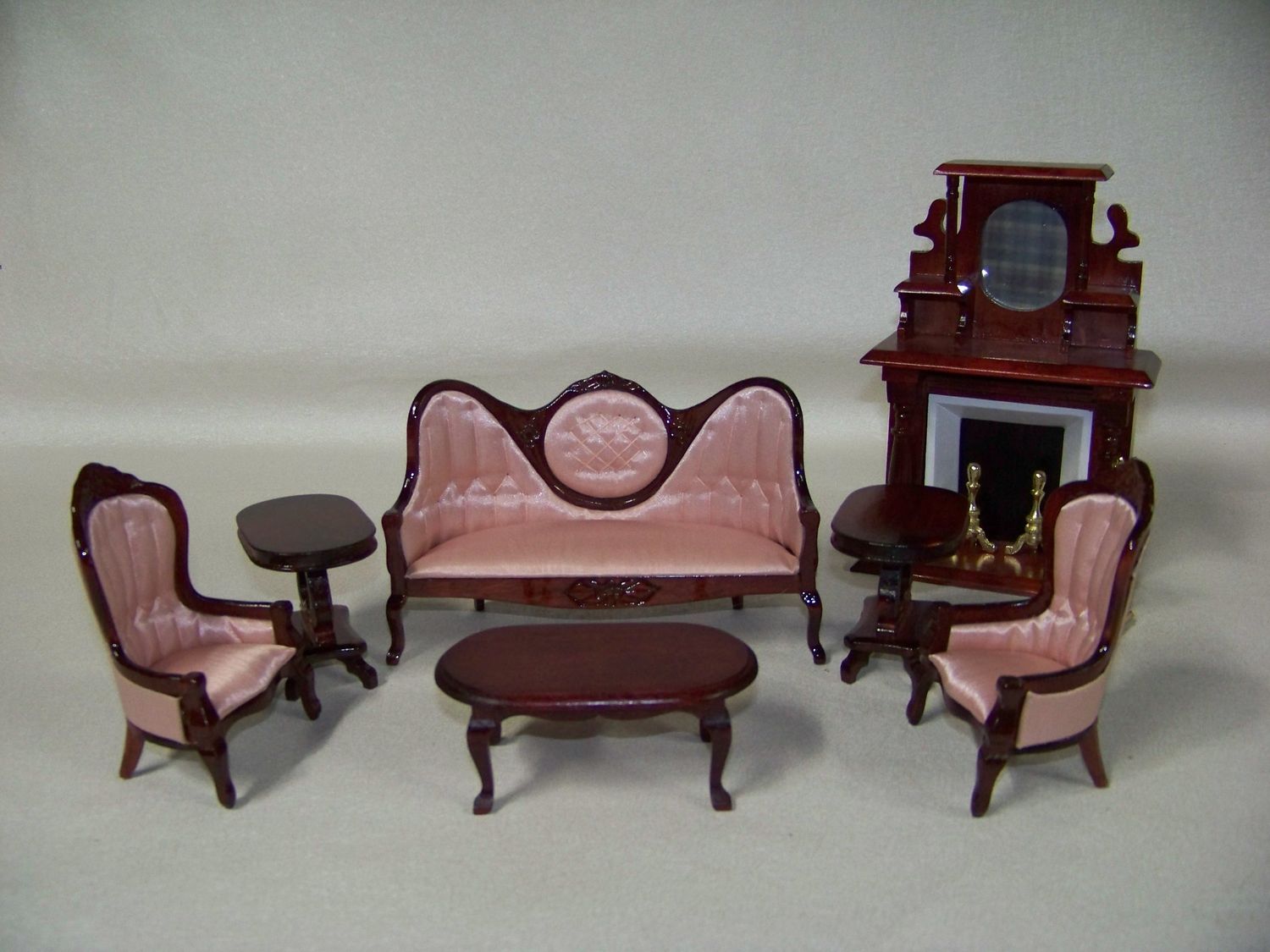 Vintage 1980s NOS wooden Parlor furniture includes Fireplace, Pink Sofa, coffee table with Red Mahogany colored stain