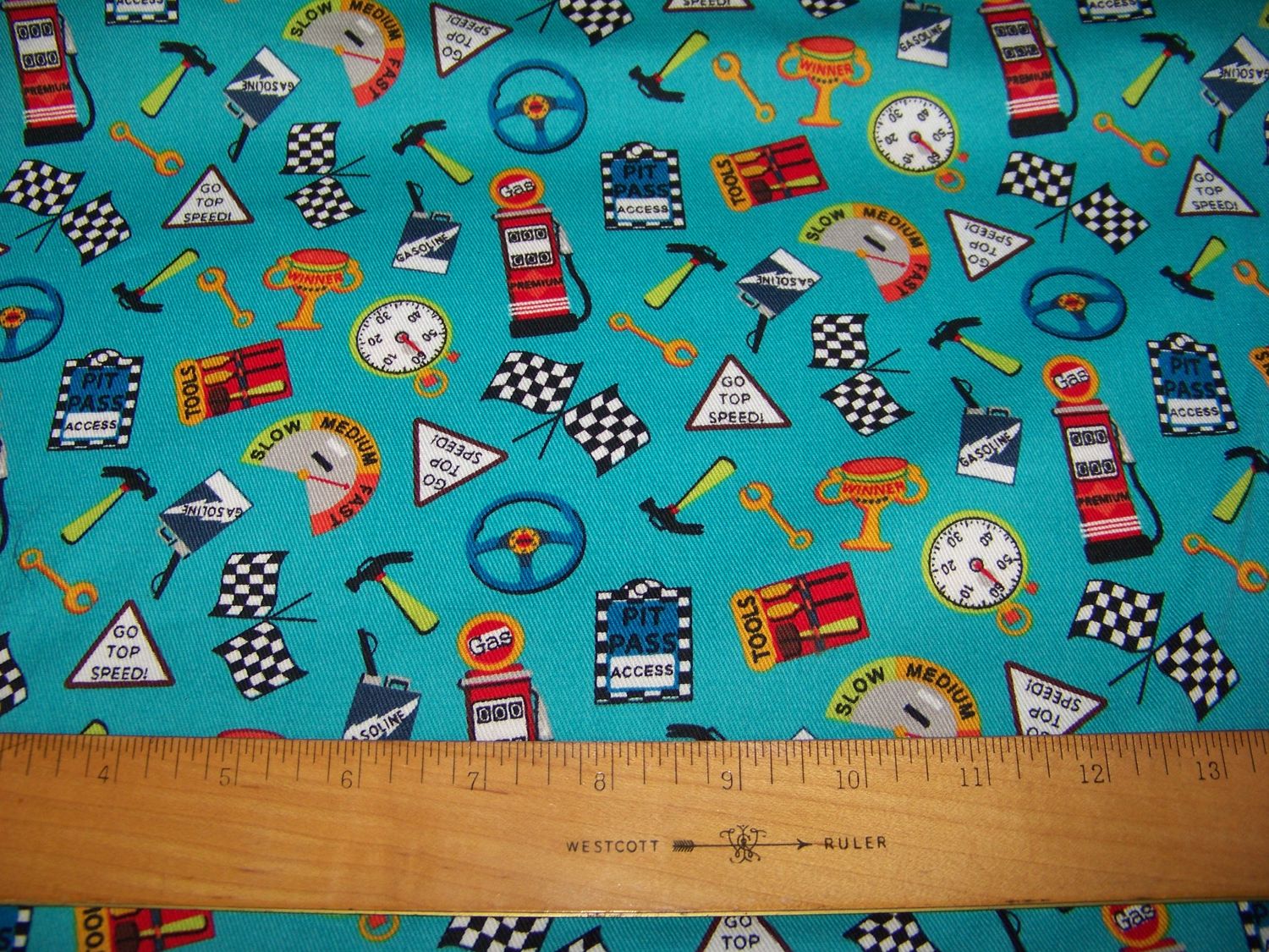 Car print Twill Fabric with Turquoise background Gas pumps, racing flags, pit pass, steering wheel, Tools, gasoline can great for boys room