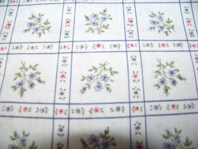 Lt. blue fabric with squares of flowers great for quilts, table clothes, pillows 45" and 8 yards