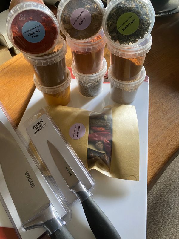 Chef knives, chopping board and spices