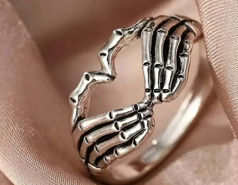Skeleton hand heart ring