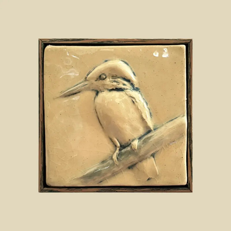 A stunning framed ceramic feature tile depicting a kingfisher perched on a branch, measuring 12cm x 12cm