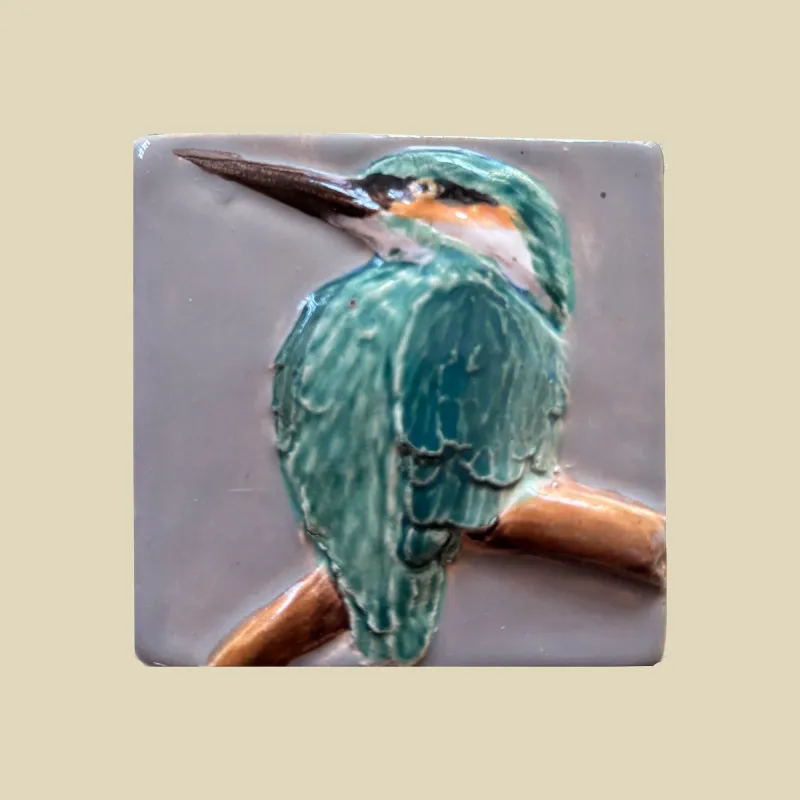 A stunning jade green kingfisher set against a grey background, measuring 6.5cm x 6.5cm.