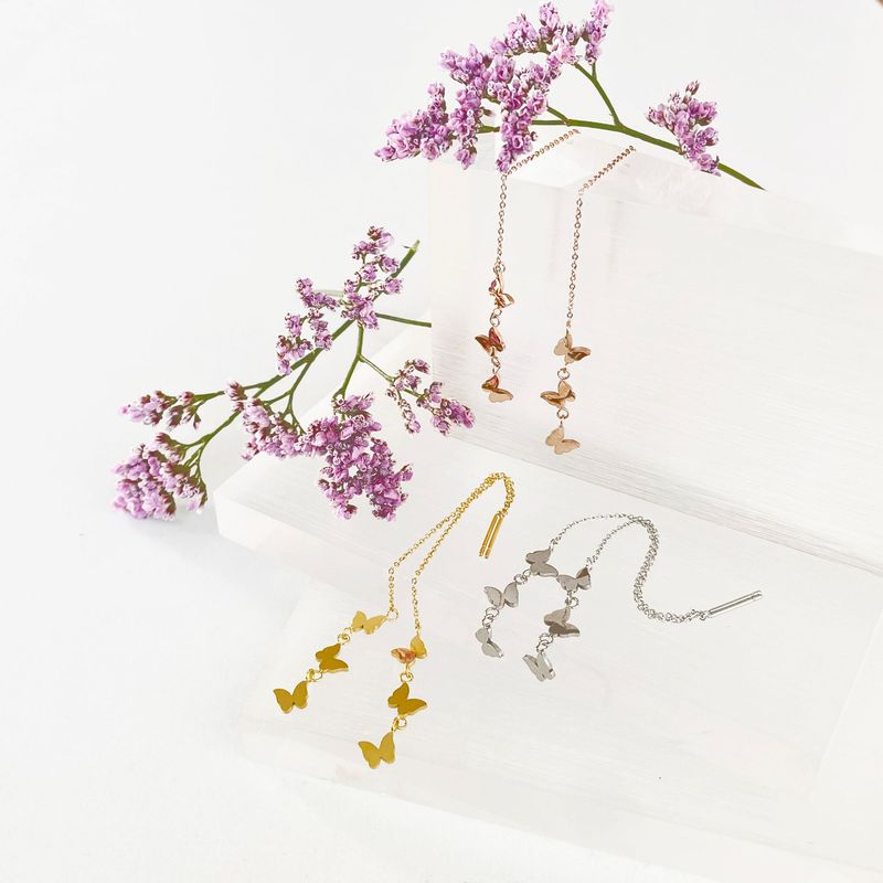 Durchzieher Fädelohrringe mit Schmetterlingen Durchzieher Fädelohrringe mit Schmetterlingen