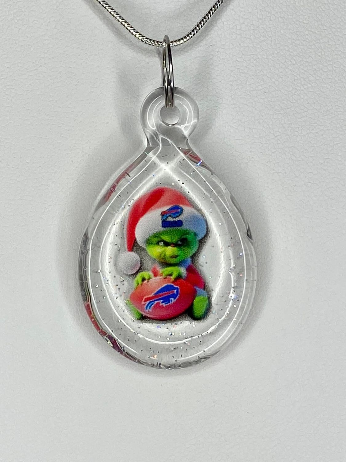 🏈 Baby Grinch, Bills 🏈 Buffalo Football Handmade Borosilicate Glass Pendant with UV-DTF decal