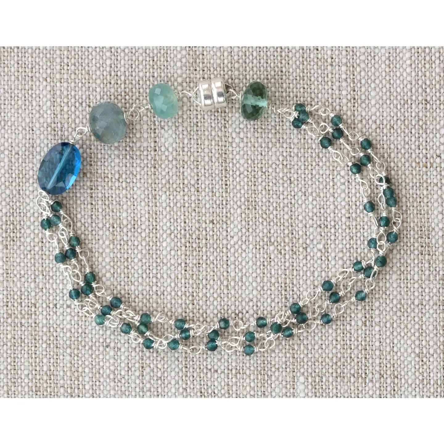 B-3877 SILVER MAGNETIC BRACELET - 7.0" LONDON BLUE QUARTZ, GRANDIDIERITE, MOSS AQUAMARINE, GREEN QUARTZ 3 STRAND