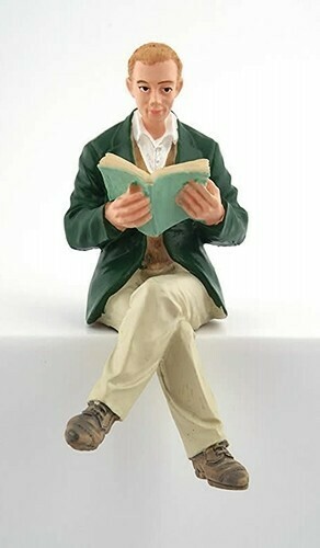 MAN SITTING WITH BOOK