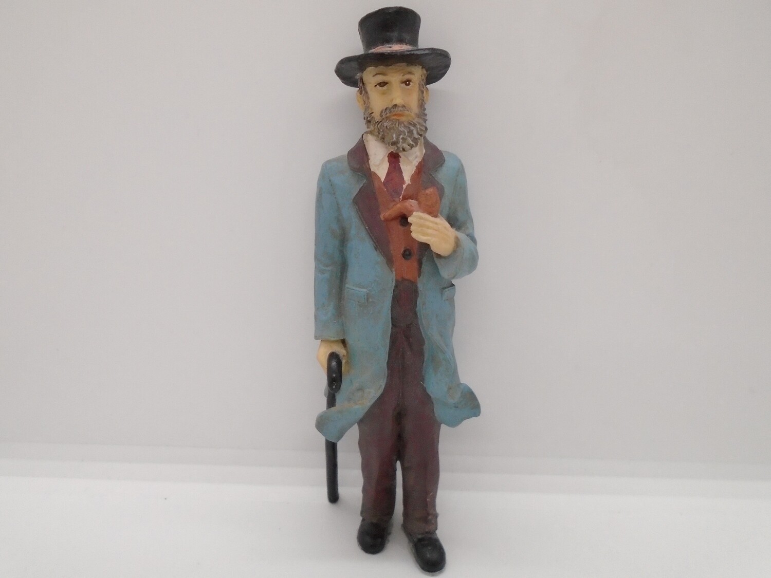 MAN WITH PIPE AND WALKING STICK
