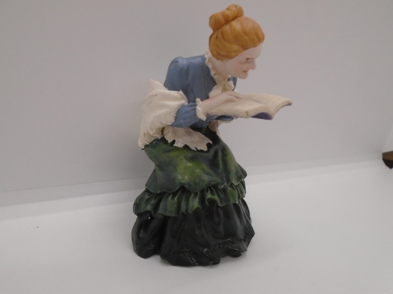 LADY SAT READING  A BOOK