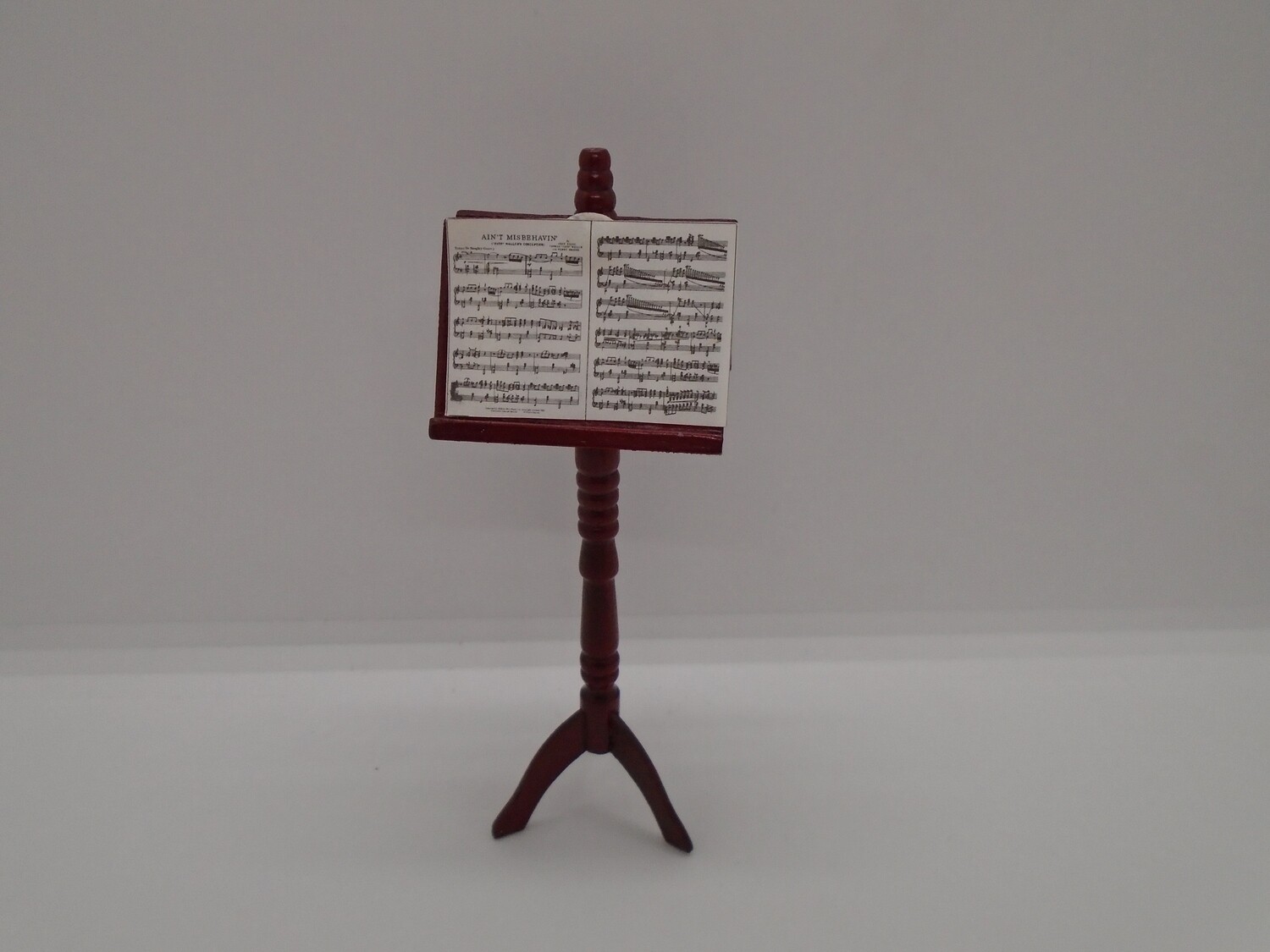 CARVED MUSIC STAND AND MUSIC