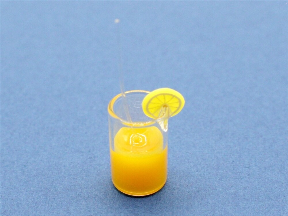 GLASS OF ORANGE JUICE, SLICE AND STRAW