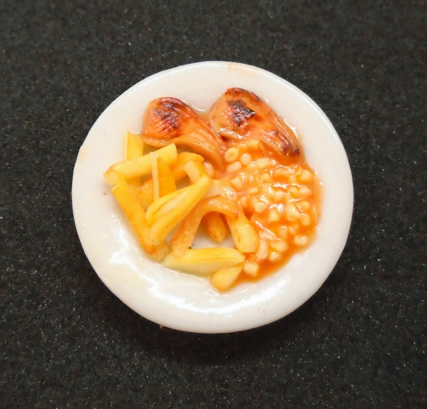 CHOPS, CHIPS AND BEANS ON CHINA PLATE