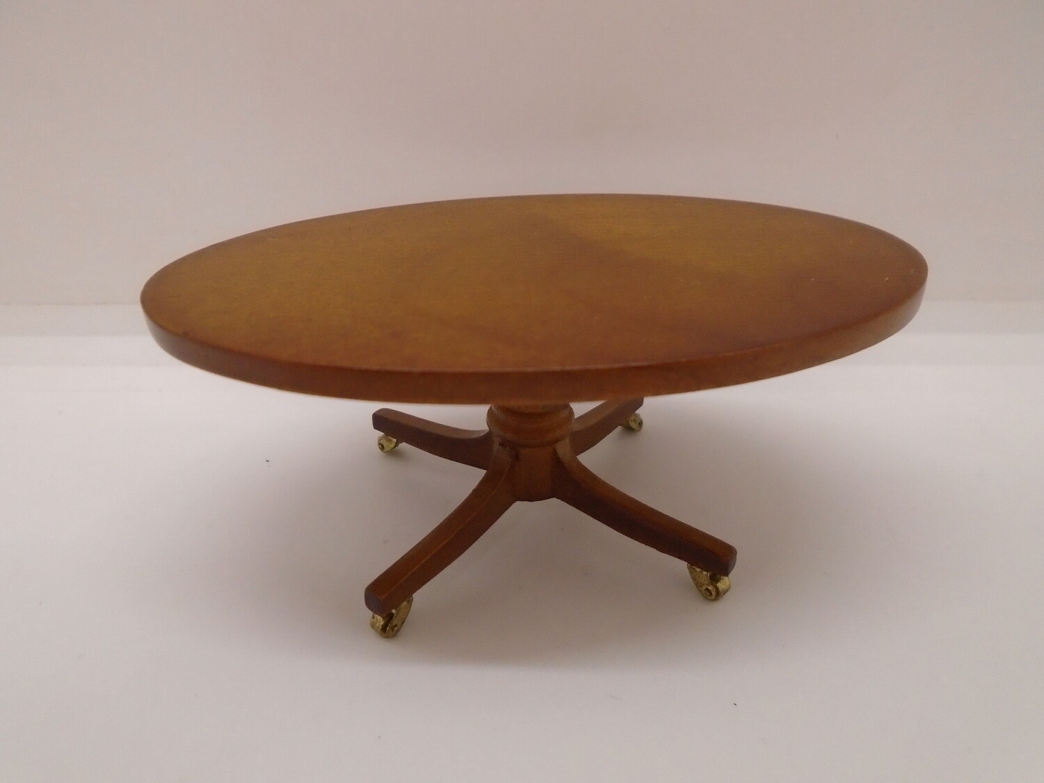LUTYENS OVAL COFFEE TABLE ON CASTORS
