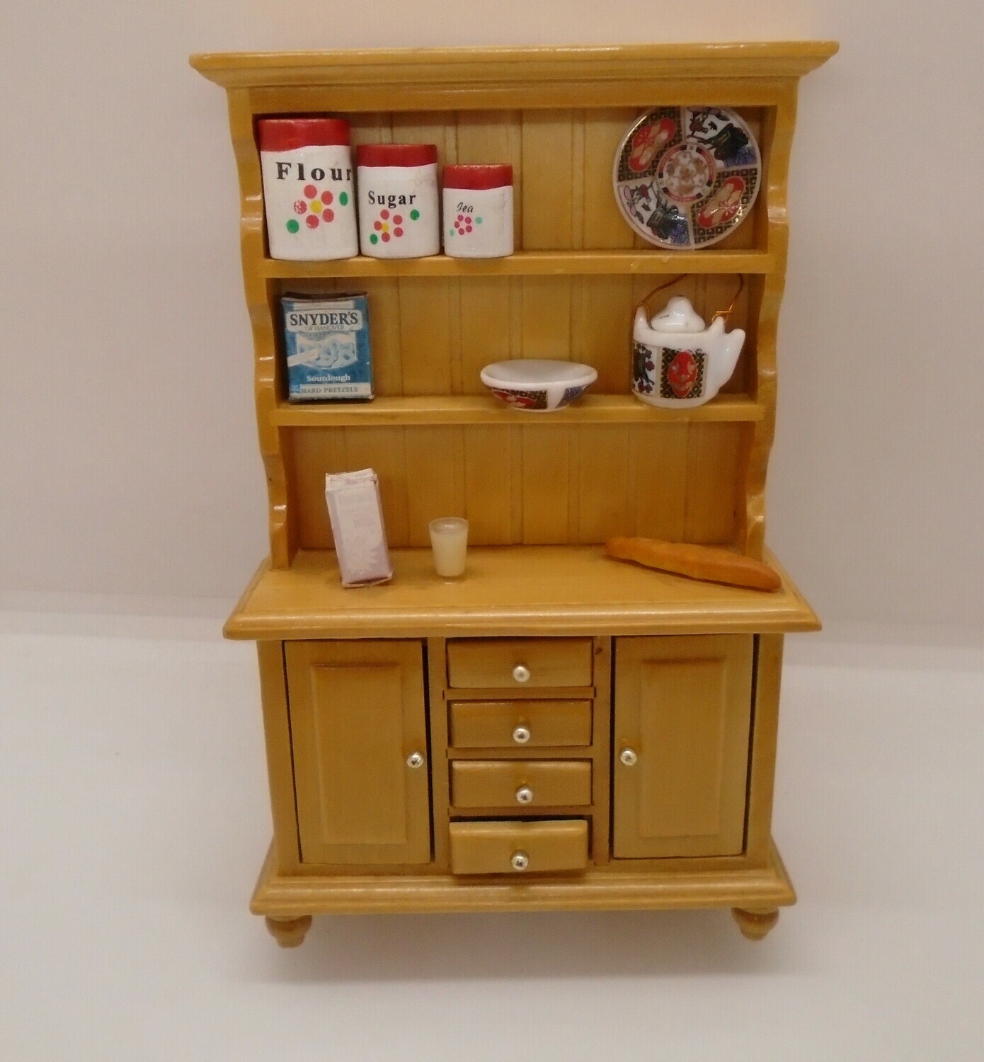 STAGED  DRESSER WITH COOKING INGREDIENTS