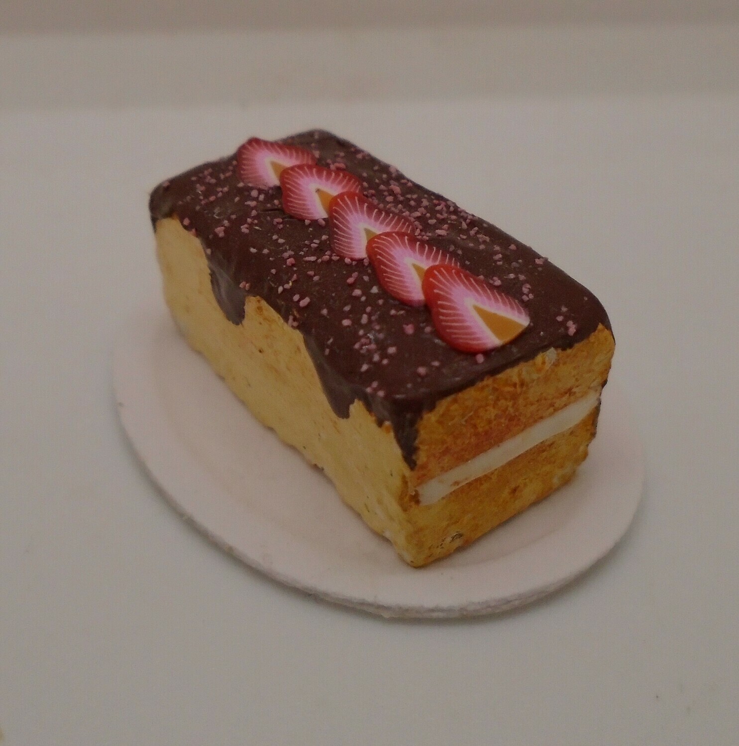CAKE WITH CHOCOLATE ICING AND TOPPED WITH STRAWBERRIES