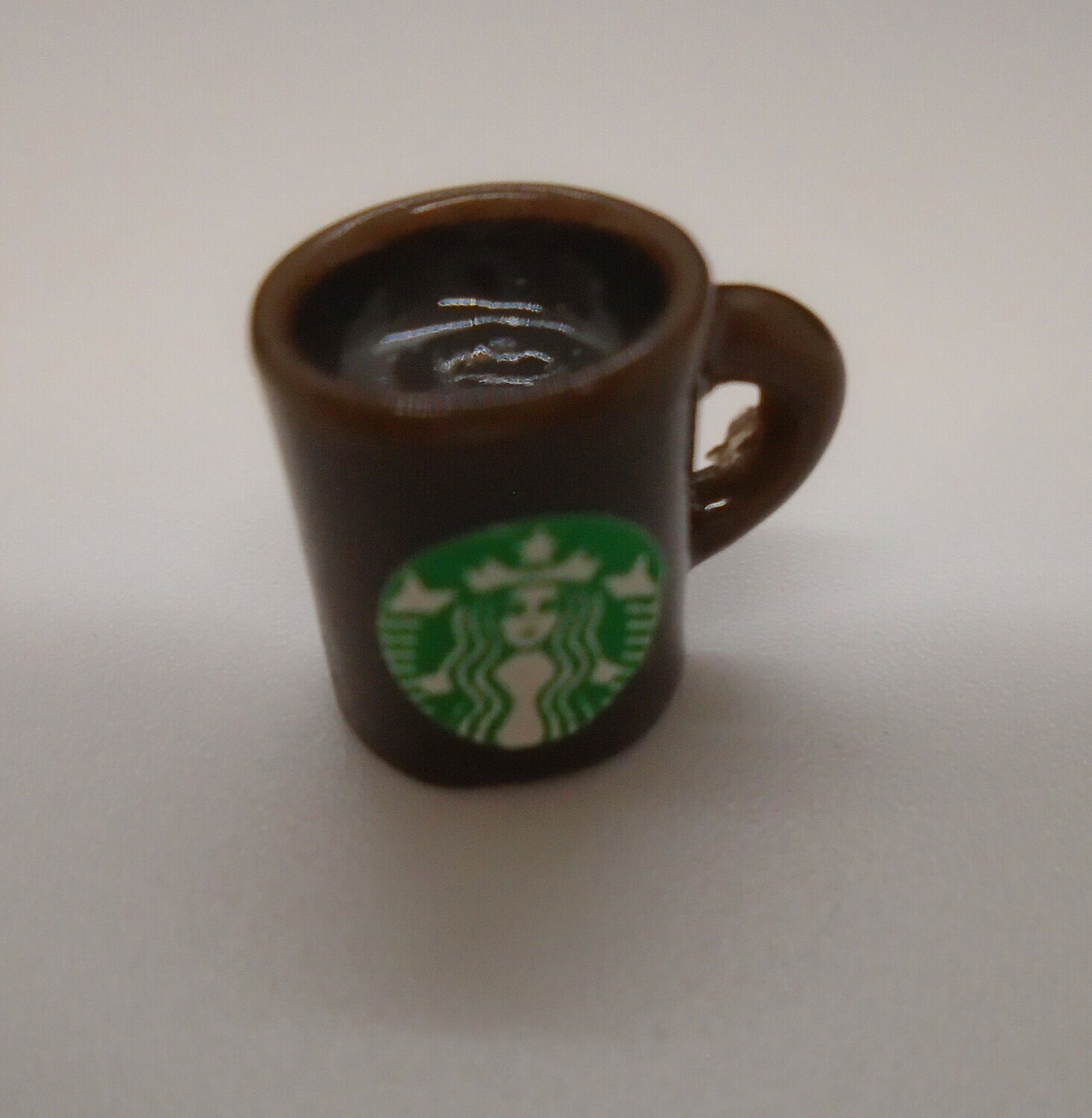 STARBUCKS CHINA MUG WITH COFFEE IN BROWN