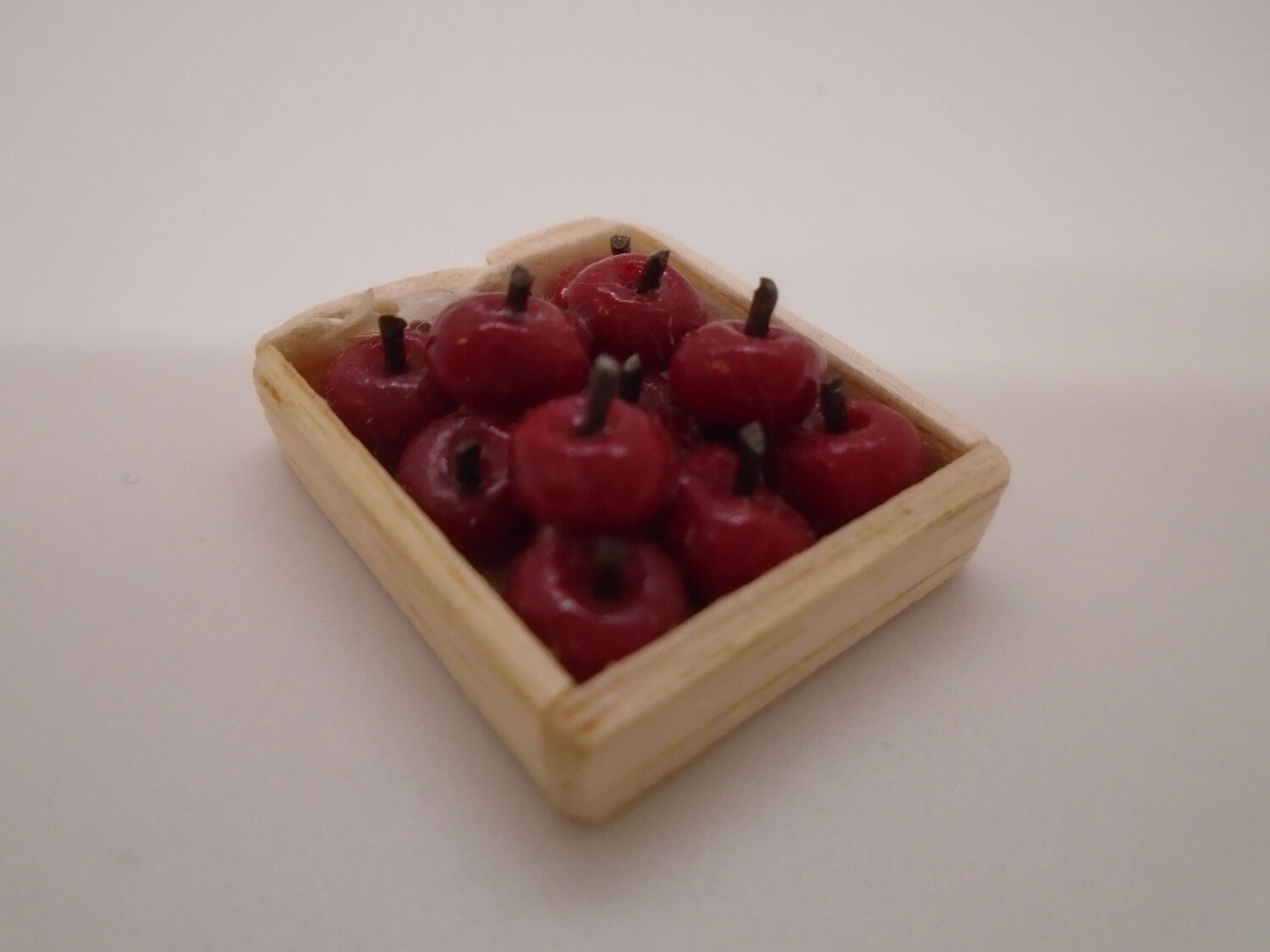 CRATE OF RED APPLES